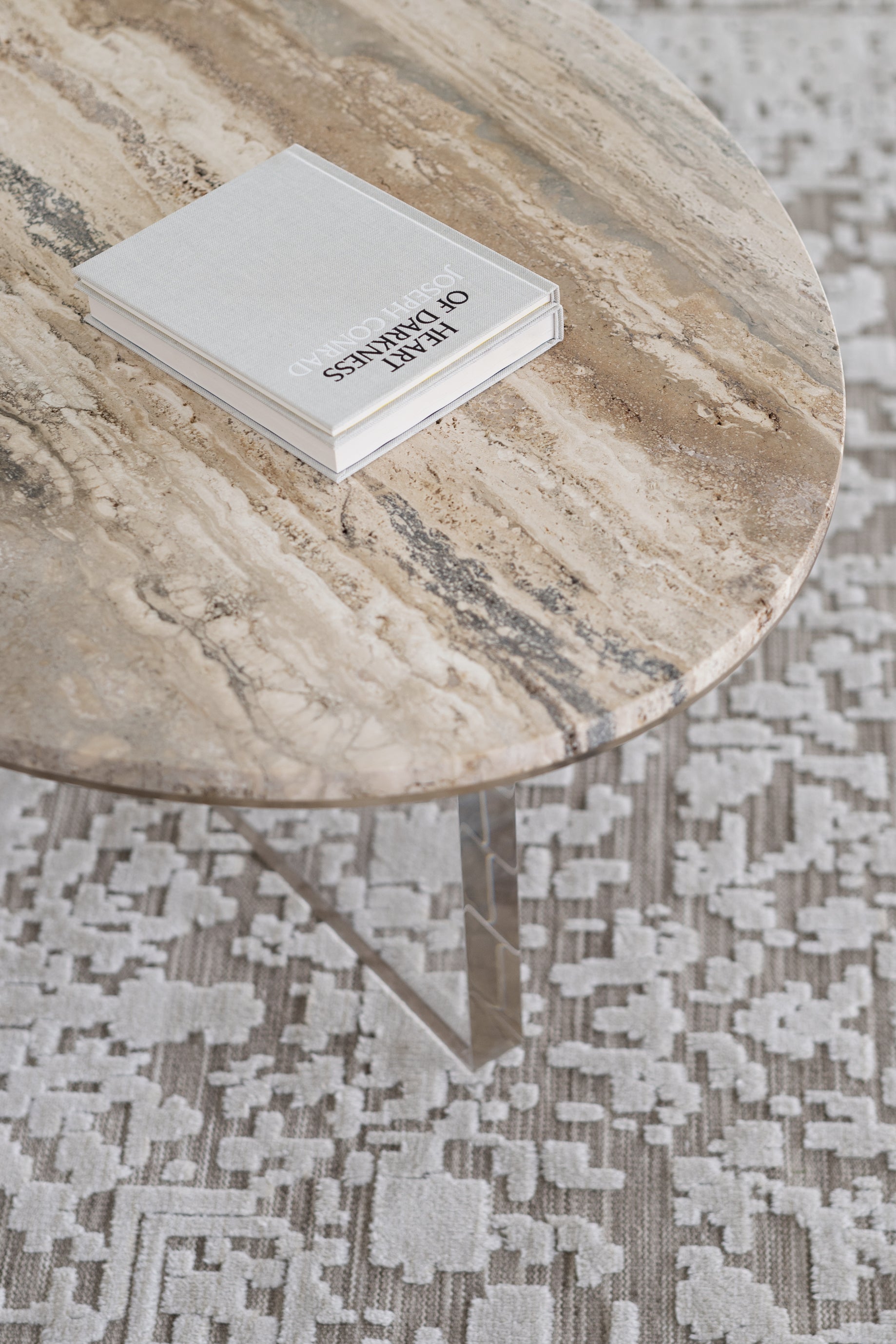 The OVAL travertine and acrylic coffee table
